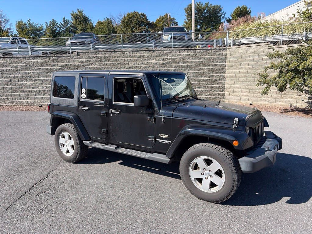2011 Jeep Wrangler Unlimited Sahara — photo 1 of 11