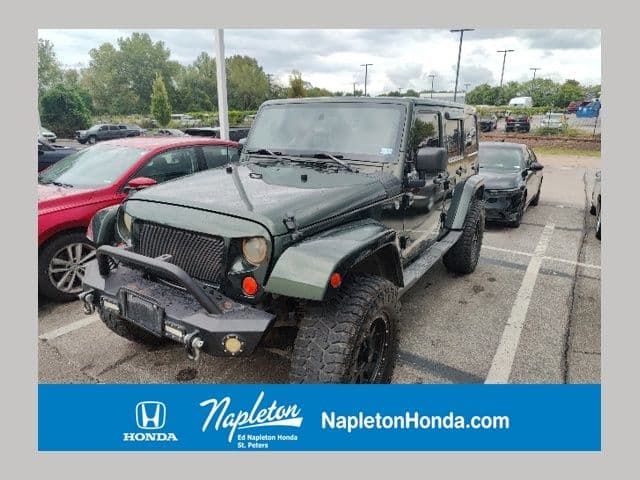 2011 Jeep Wrangler Unlimited Sahara — photo 1 of 31